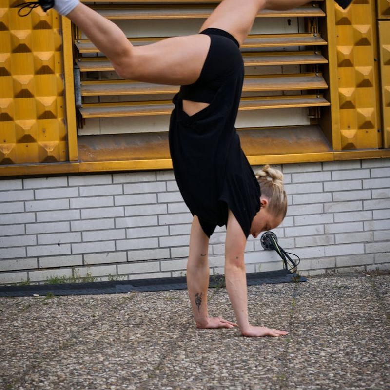 Man performing a dynamic bodyweight exercise with controlled movement.